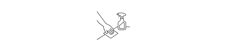 A hand holding a cloth is spraying a cleaning solution.